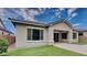 Charming single-story home showcasing a manicured lawn and a covered patio, ideal for outdoor enjoyment at 23497 S 212Th St, Queen Creek, AZ 85142