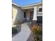 Inviting front porch with desert landscaping featuring cacti and drought-resistant plants along the walkway at 23497 S 212Th St, Queen Creek, AZ 85142