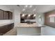 Modern kitchen featuring granite countertops, stainless steel appliances, and a spacious center island at 23497 S 212Th St, Queen Creek, AZ 85142