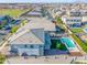 Aerial shot showcasing a home with a backyard pool in a residential neighborhood at 25725 S 230Th St, Queen Creek, AZ 85142
