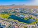 Beautiful aerial view of the community, showcasing the lake, pool, mountains and surrounding landscape at 25725 S 230Th St, Queen Creek, AZ 85142