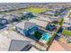 Overhead view of a home with a backyard pool within a suburban community at 25725 S 230Th St, Queen Creek, AZ 85142