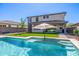 Backyard with a pool, patio, and artificial grass, perfect for outdoor living at 25725 S 230Th St, Queen Creek, AZ 85142