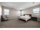 Spacious bedroom with natural light, carpet flooring, and calming neutral color palette at 25725 S 230Th St, Queen Creek, AZ 85142