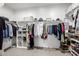 Walk-in closet with custom shelving, hanging racks, and ample storage for clothing at 25725 S 230Th St, Queen Creek, AZ 85142