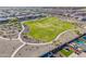 An aerial view features a lush community park with walking trails and open spaces at 25725 S 230Th St, Queen Creek, AZ 85142
