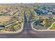 Overhead view highlighting a landscaped community street with homes on either side at 25725 S 230Th St, Queen Creek, AZ 85142