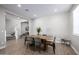 Dining room with tile flooring, and a view of the stairway with white banisters at 25725 S 230Th St, Queen Creek, AZ 85142