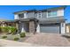 Lovely two-story home with gray colors, stone accents, front porch, and two car garage at 25725 S 230Th St, Queen Creek, AZ 85142