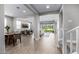 Open floor plan with neutral colors and tile, flowing into living and dining areas at 25725 S 230Th St, Queen Creek, AZ 85142