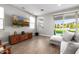 Living room featuring a tv and access to the backyard and swimming pool at 25725 S 230Th St, Queen Creek, AZ 85142