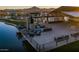 Stylish outdoor lounge area by the water, offering comfortable seating and a peaceful setting at 25725 S 230Th St, Queen Creek, AZ 85142