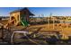 Fun community playground for children featuring a slide, swings, and creative play structures at 25725 S 230Th St, Queen Creek, AZ 85142