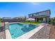 Beautiful backyard pool and landscape with an artificial grass surround at 25725 S 230Th St, Queen Creek, AZ 85142