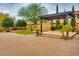 Paver patio with gazebo, green grass, mature landscaping, and an inviting outdoor space with new construction at 26926 N 55Th Ln, Phoenix, AZ 85083