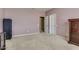 Spacious bedroom with carpeted floors, closet, and window at 26926 N 55Th Ln, Phoenix, AZ 85083