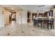 Open dining area adjacent to the kitchen, featuring dark wood cabinets and stylish light fixtures at 26926 N 55Th Ln, Phoenix, AZ 85083