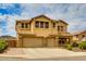Two-story stucco home with a three-car garage and a well-manicured front yard in a desirable neighborhood at 26926 N 55Th Ln, Phoenix, AZ 85083