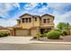 Spacious two-story home with a three-car garage and desert landscaping offers both beauty and functionality at 26926 N 55Th Ln, Phoenix, AZ 85083