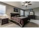 Cozy primary bedroom with plush carpeting, dark wood furniture, and warm decor at 26926 N 55Th Ln, Phoenix, AZ 85083