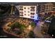 Aerial view of an outdoor restaurant space with illuminated seating and tables at night at 2721 E Tamarisk St, Gilbert, AZ 85296