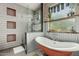 Stylish bathroom with soaking tub, walk-in shower, and modern fixtures at 2721 E Tamarisk St, Gilbert, AZ 85296