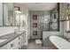 Elegant bathroom showcasing a soaking tub, walk-in shower, and dual vanity at 2721 E Tamarisk St, Gilbert, AZ 85296
