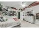Bright, inviting bedroom with decor, a ceiling fan, a queen-sized bed, dresser, and closet at 2721 E Tamarisk St, Gilbert, AZ 85296