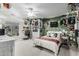 Inviting bedroom with bright walls, featuring unique decorations, a ceiling fan, and a queen-sized bed at 2721 E Tamarisk St, Gilbert, AZ 85296