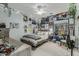 A creative bedroom featuring posters, a comfortable bed, ceiling fan, and natural light at 2721 E Tamarisk St, Gilbert, AZ 85296