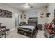Comfortable bedroom featuring a ceiling fan, natural light and modern furnishings at 2721 E Tamarisk St, Gilbert, AZ 85296