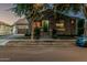 Charming home exterior with a well-manicured lawn, welcoming entrance and attached garage, creating curb appeal at 2721 E Tamarisk St, Gilbert, AZ 85296