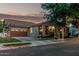 Charming home exterior with a well-manicured lawn, welcoming entrance and attached garage, creating curb appeal at 2721 E Tamarisk St, Gilbert, AZ 85296