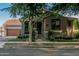Charming home exterior with a well-manicured lawn, welcoming entrance and attached garage, creating curb appeal at 2721 E Tamarisk St, Gilbert, AZ 85296