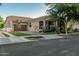 Charming home exterior with a well-manicured lawn, welcoming entrance and attached garage, creating curb appeal at 2721 E Tamarisk St, Gilbert, AZ 85296