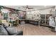 Multi-purpose room with a large sewing and crafting table, storage, and decorative wallpaper at 2721 E Tamarisk St, Gilbert, AZ 85296