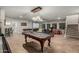 Large game room features a pool table, media screen, and dining area perfect for entertaining guests at 2721 E Tamarisk St, Gilbert, AZ 85296