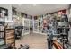 Spacious home gym featuring multiple exercise machines and equipment with a view to the other room at 2721 E Tamarisk St, Gilbert, AZ 85296