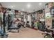 Fully-equipped home gym with various exercise machines and weights for a complete workout experience at 2721 E Tamarisk St, Gilbert, AZ 85296