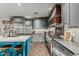 Well-equipped kitchen with stainless steel appliances, center island, and stylish countertop decor at 2721 E Tamarisk St, Gilbert, AZ 85296