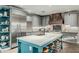 Spacious kitchen with stainless steel appliances, large island and custom backsplash at 2721 E Tamarisk St, Gilbert, AZ 85296
