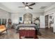 Cozy main bedroom with decorative headboard, wood floors, and stylish furnishings at 2721 E Tamarisk St, Gilbert, AZ 85296