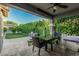 The patio includes a dining table, chairs, and an outdoor kitchen with a grill at 2721 E Tamarisk St, Gilbert, AZ 85296