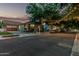 Neighborhood street view featuring houses with mature trees and parked cars along the curb, highlighting community charm at 2721 E Tamarisk St, Gilbert, AZ 85296
