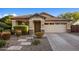 Charming home with a well-maintained front yard, stone accents, and welcoming walkway at 2823 E Charlotte Dr, Phoenix, AZ 85024