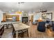 Open-concept living space with a large sectional, dining table, and seamless flow to the kitchen at 2823 E Charlotte Dr, Phoenix, AZ 85024