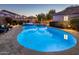 Stunning backyard pool and spa with a beautifully landscaped patio, perfect for outdoor entertaining and relaxation at 2823 E Charlotte Dr, Phoenix, AZ 85024