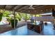 Spacious covered patio with outdoor dining, string lights, and view of the pool at 3323 N 28Th St, Phoenix, AZ 85016