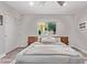 Serene bedroom with natural light, ceiling fan, hardwood floors, and a calming color palette at 3323 N 28Th St, Phoenix, AZ 85016