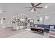 Bright, open living space featuring a modern kitchen, dining area and a comfortable blue sofa at 3323 N 28Th St, Phoenix, AZ 85016